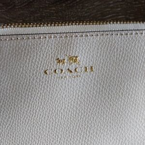 Coach cream colored wristlet